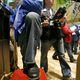 Traders wear blue jeans as they work on the floor of the New York Stock Exchange Friday, Aug. 21, 2009. Gap Inc., who celebrates their 40th anniversary, provided the jeans to traders who were allowed to wear them on the trading floor for the first time in the market's history.(AP Photo/Richard Drew)